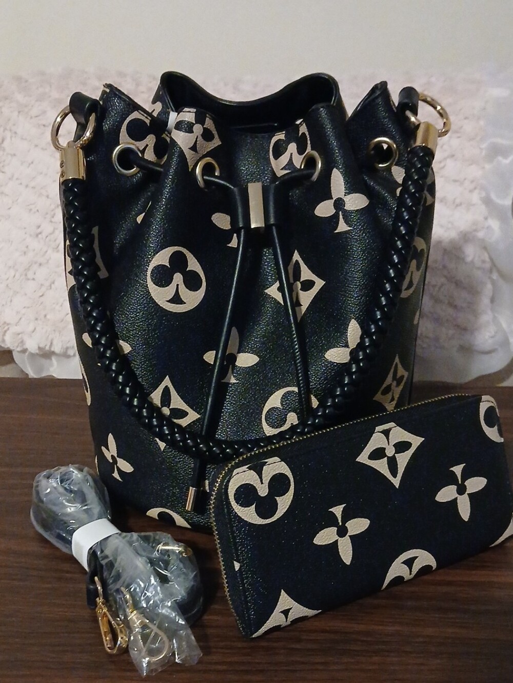 Black Drawstring Bucket Shoulder Bag with Gold Pattern and Matching Pouch